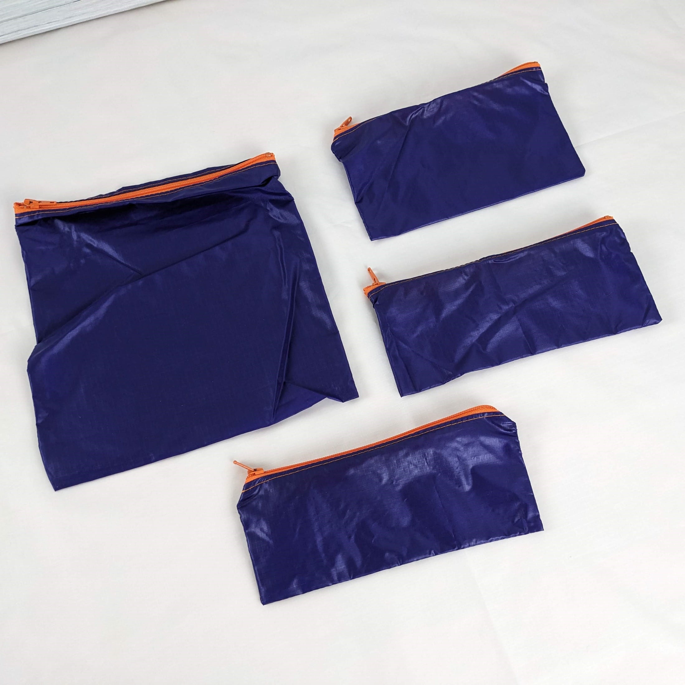 Four Purple Silky Ripstop Zipper Pouches with Orange YKK Zippers