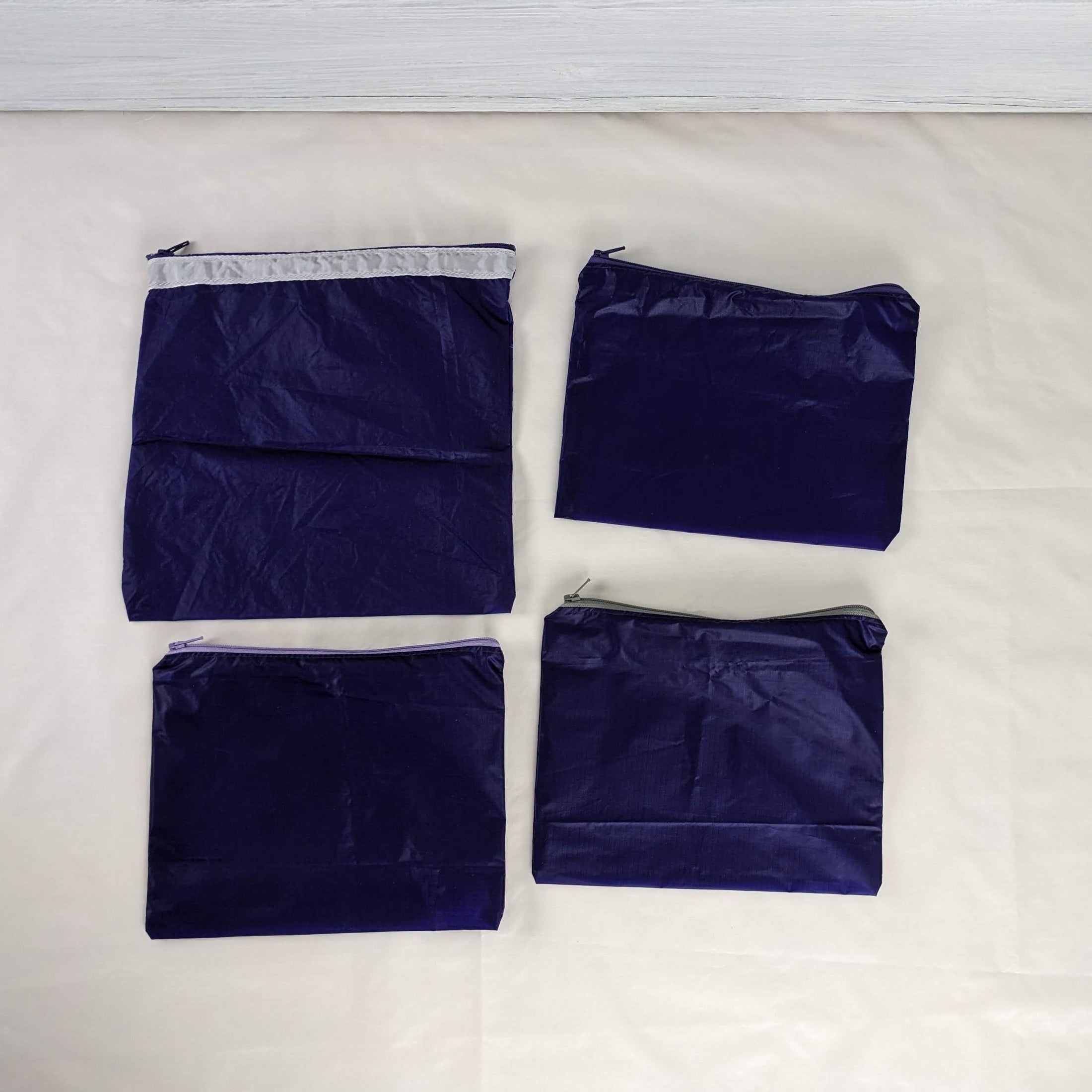 Four Purple Water Resistant Ripstop Zipper Pouches