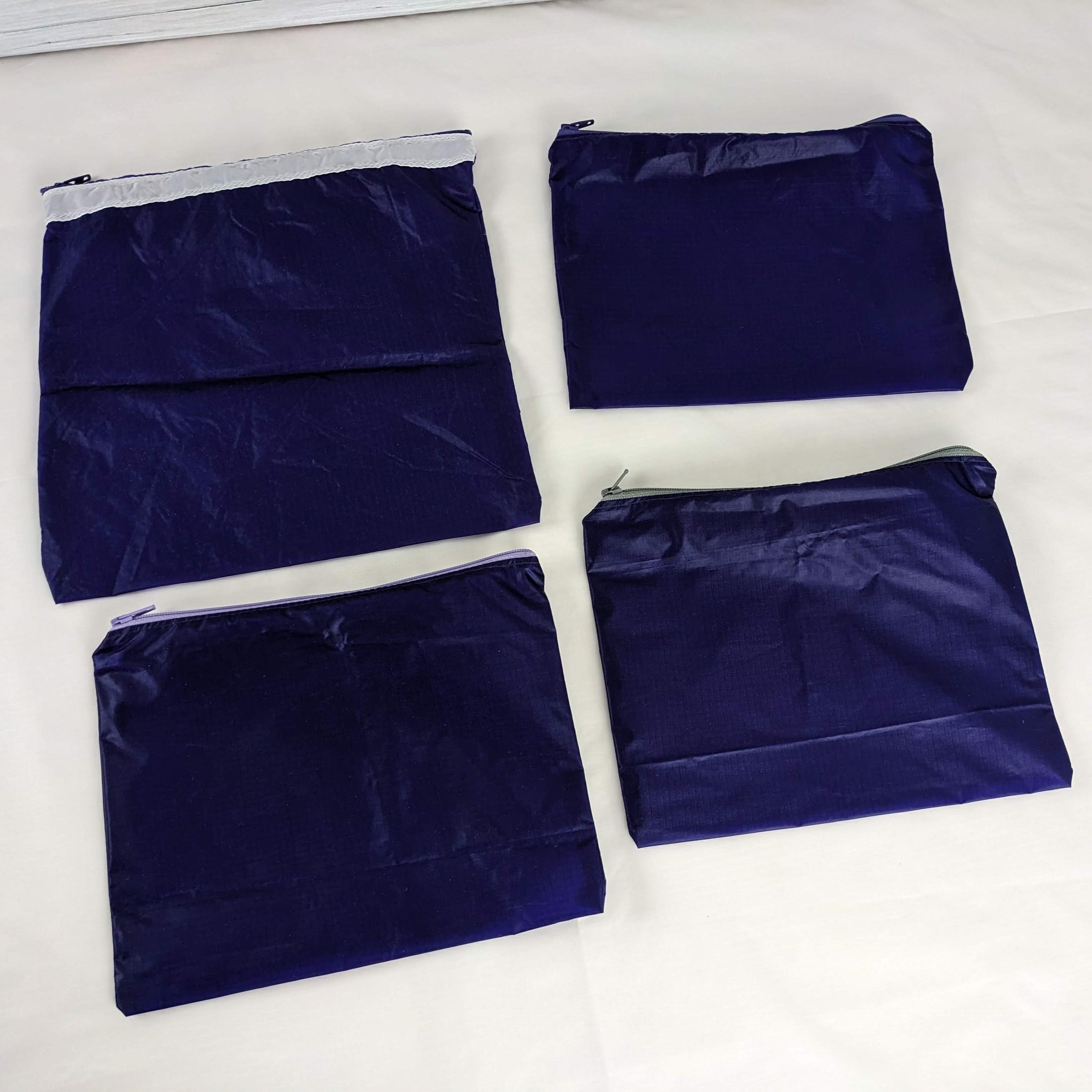 Four Purple Water Resistant Ripstop Zipper Pouches