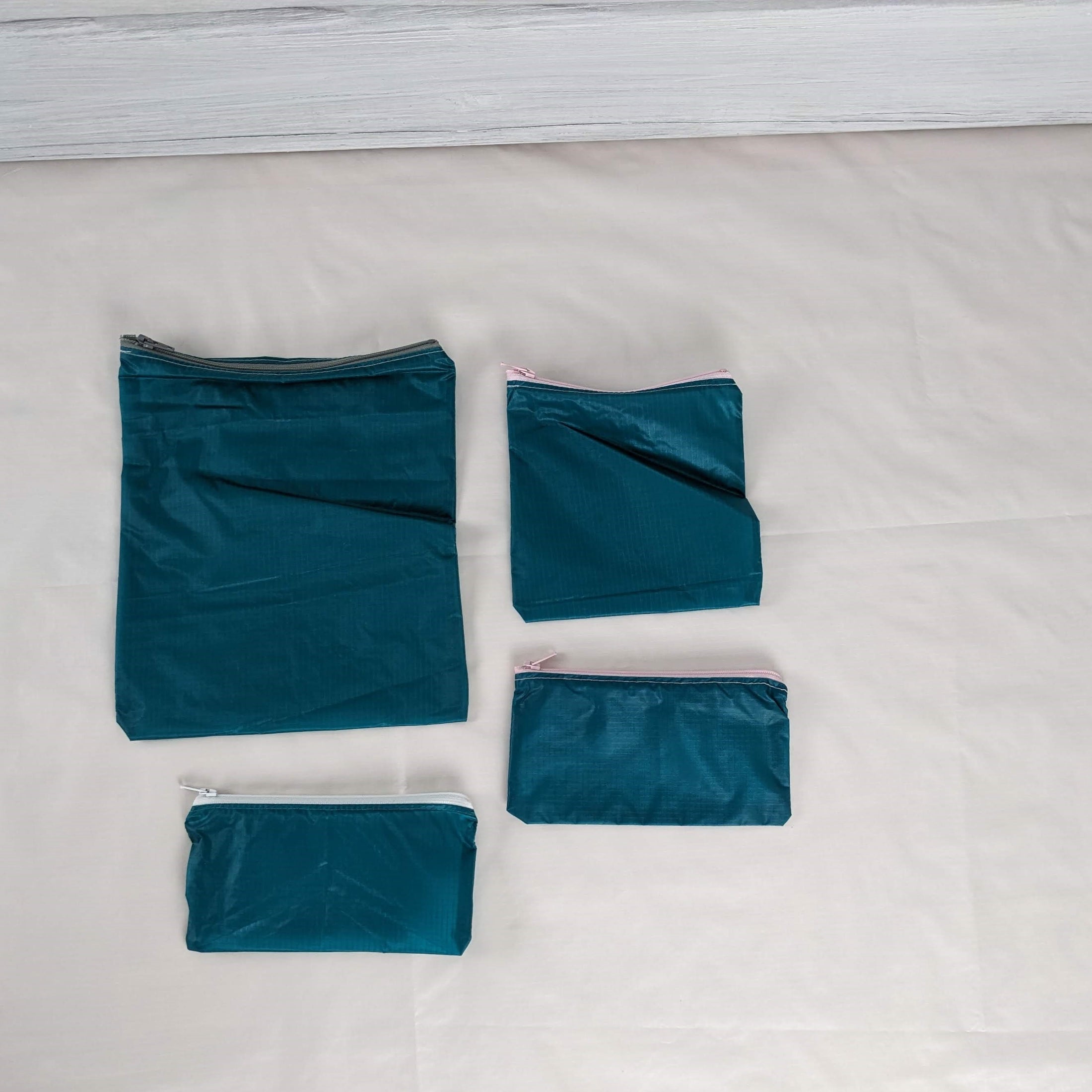 Four Teal Green Water Resistant Zipper Pouches