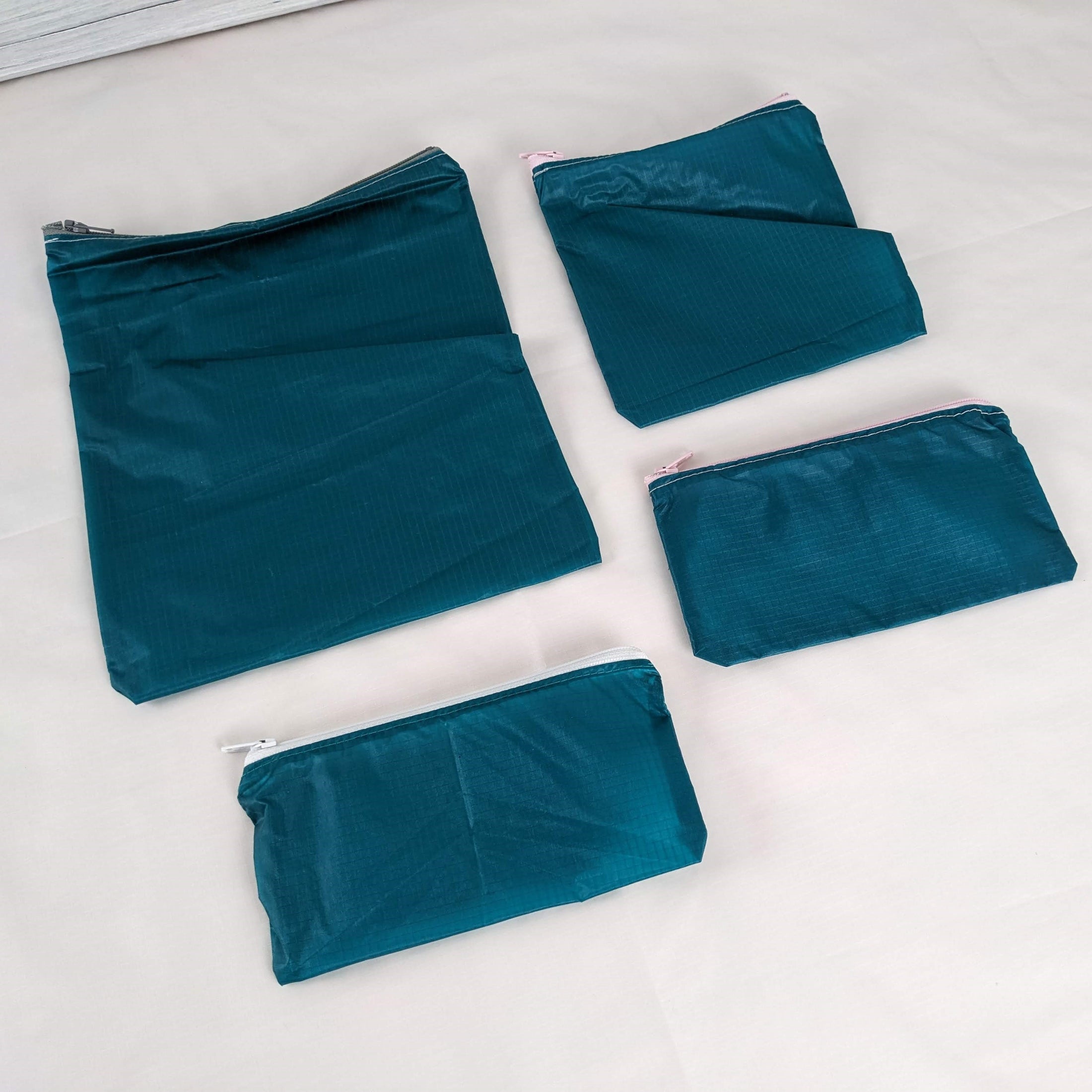 Four Teal Green Water Resistant Zipper Pouches