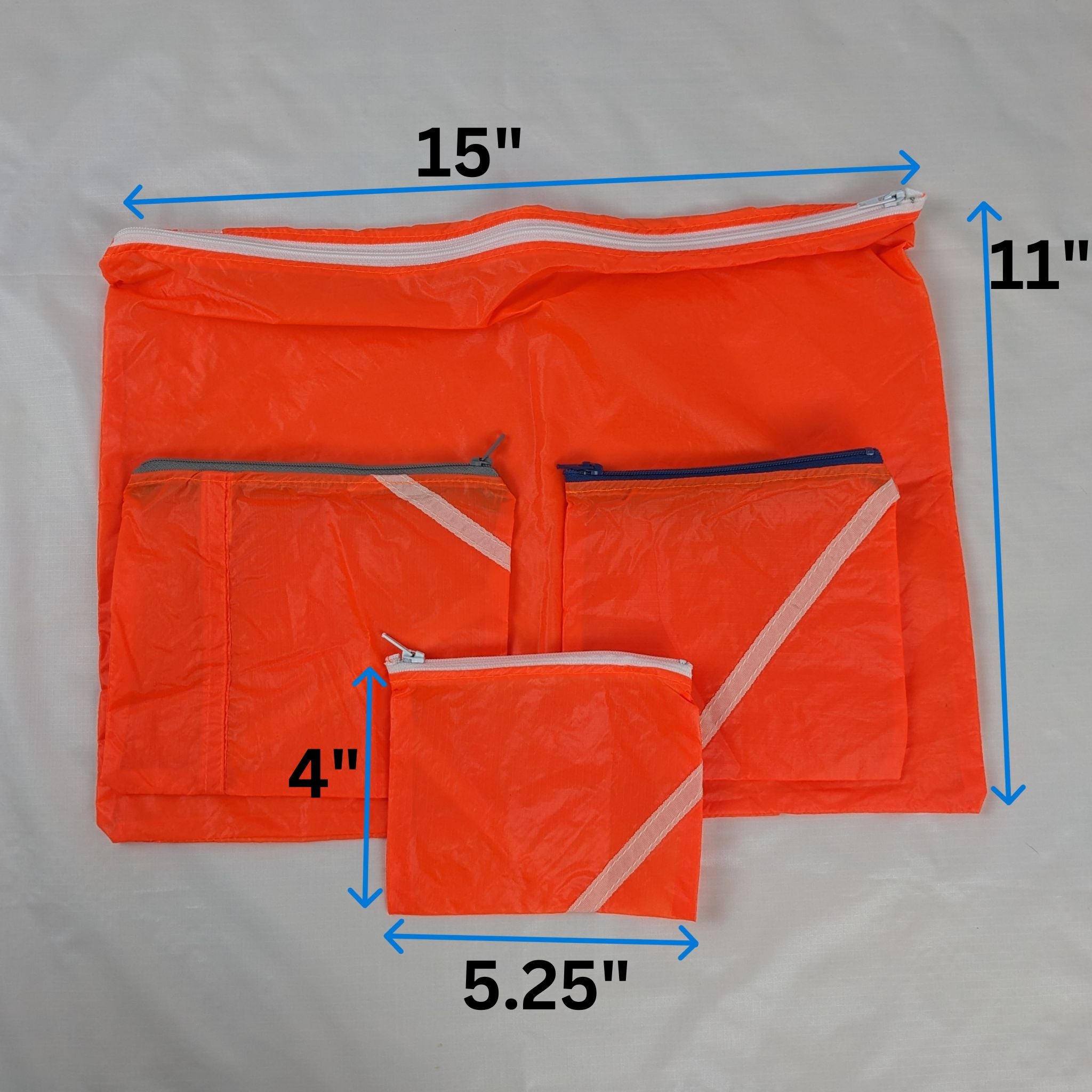 Four Repurposed Orange Zero Porosity Parachute Zipper Pouches