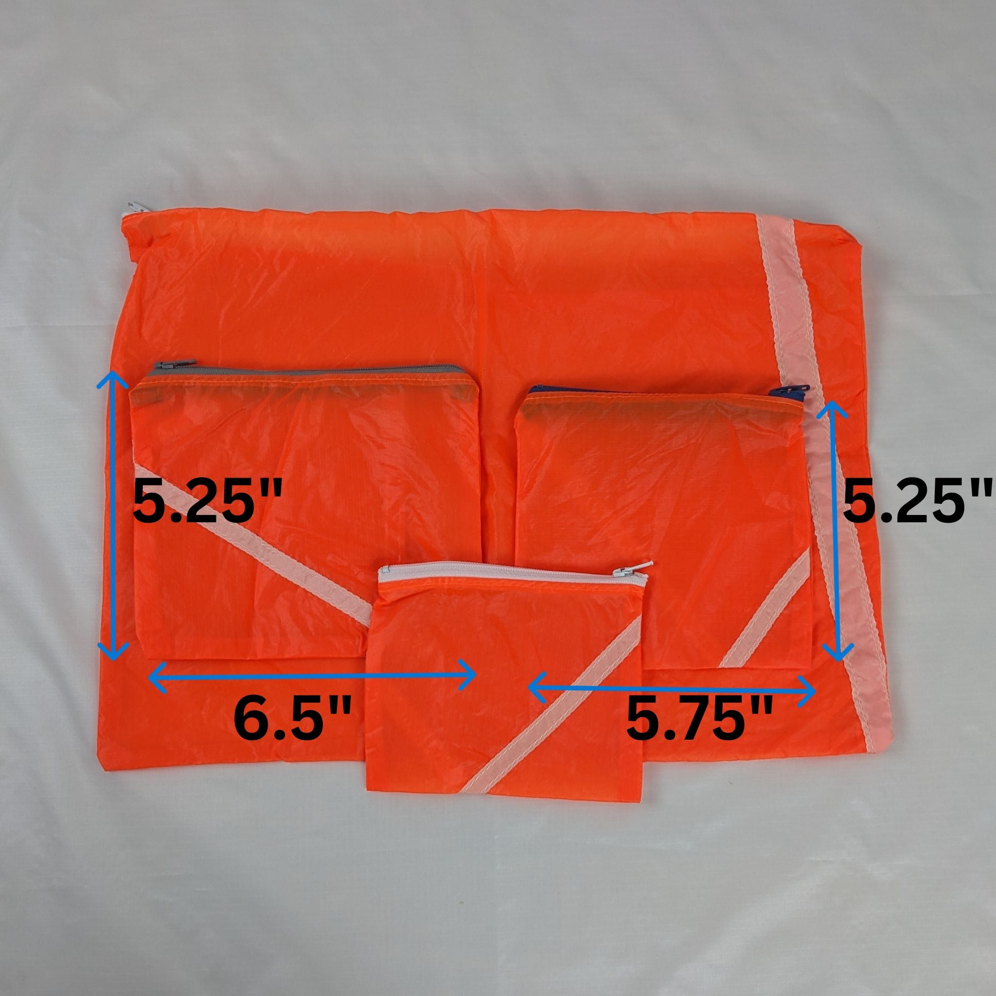 Four Repurposed Orange Zero Porosity Parachute Zipper Pouches