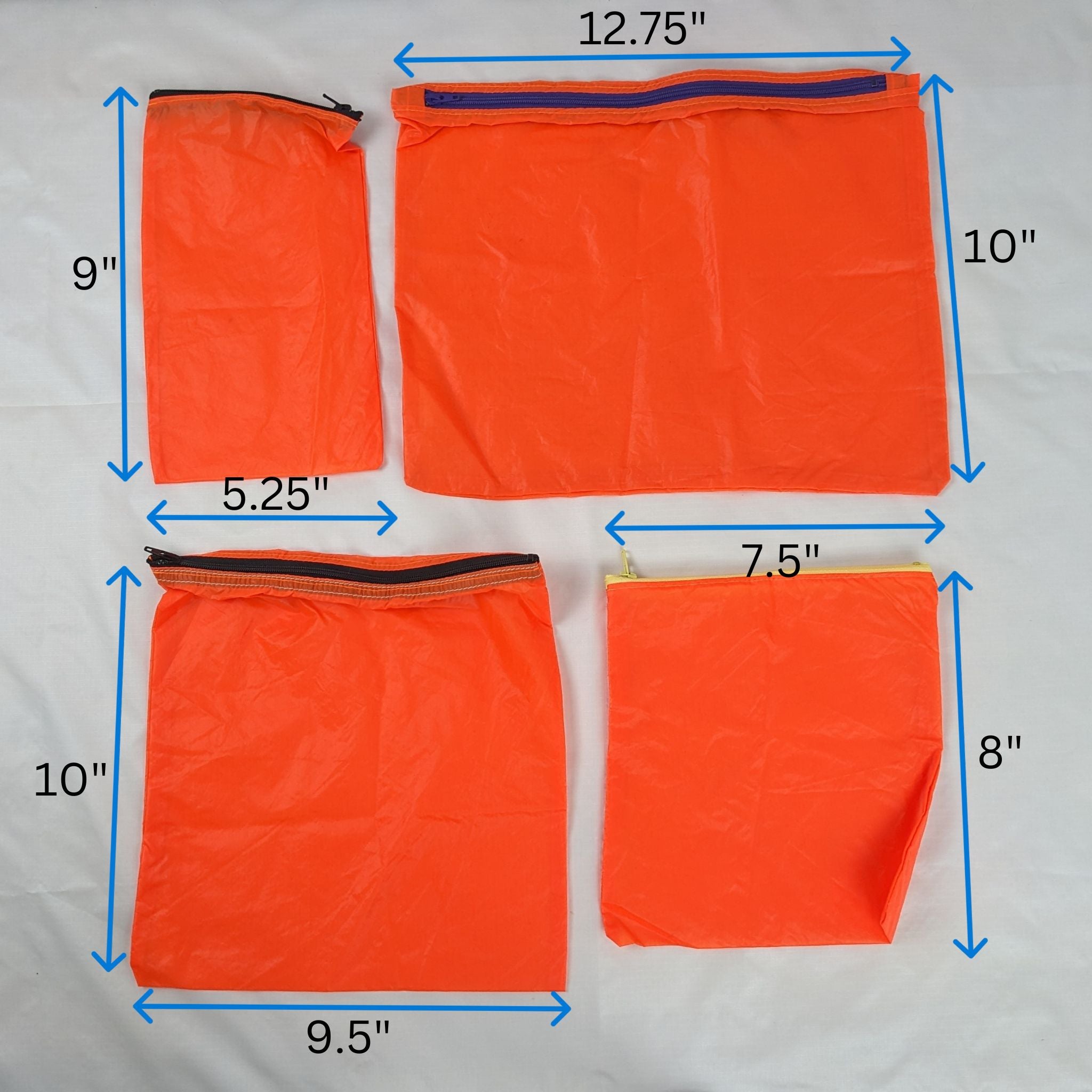 Four Orange Repurposed Water Resistant Parachute Zipper Pouches